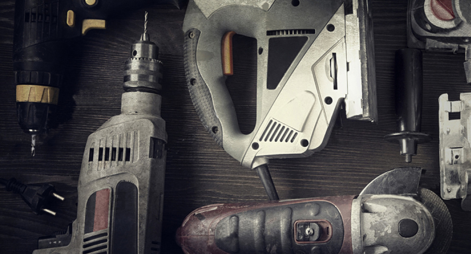 Power tools on a wooden work bench.