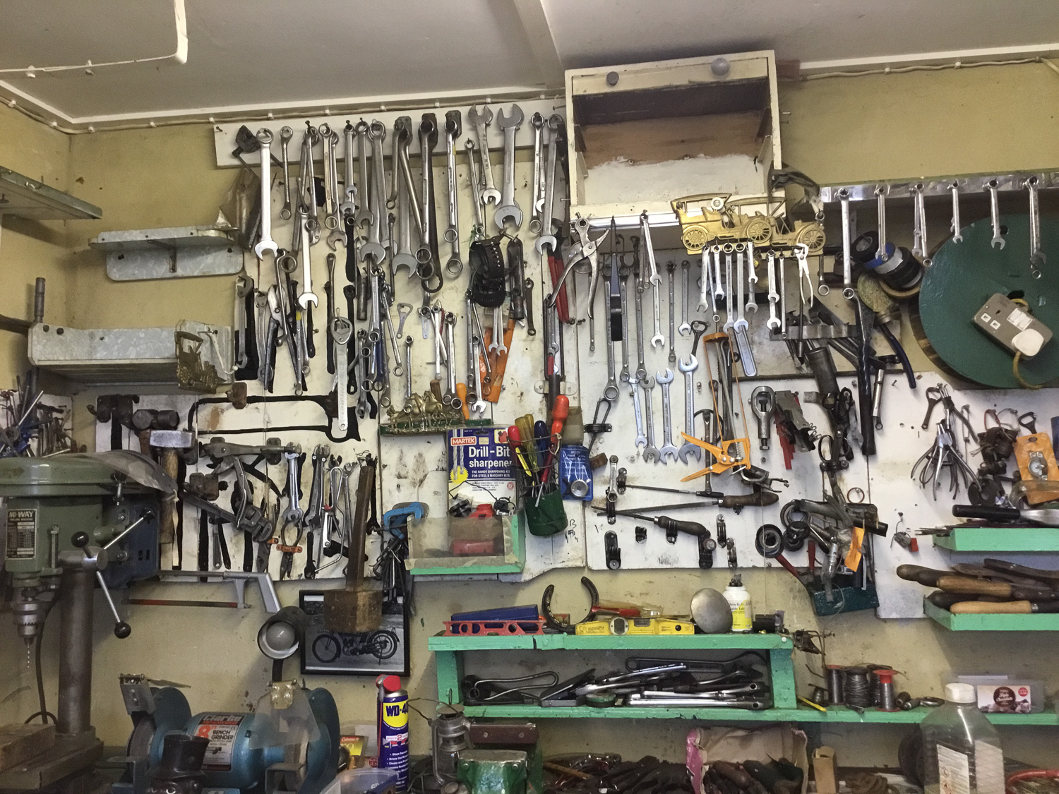 Workshop with tools hanging on the wall.